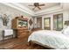 Spacious bedroom with wood floors and built in entertainment center at 11305 S 195Th Dr, Buckeye, AZ 85326
