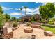 Flagstone patio with fire pit and built-in seating at 11305 S 195Th Dr, Buckeye, AZ 85326