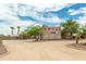 Three-car garage with stucco exterior and large driveway at 11305 S 195Th Dr, Buckeye, AZ 85326