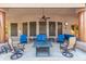 Large covered patio with seating and fire pit at 11305 S 195Th Dr, Buckeye, AZ 85326