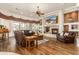 Spacious living room with hardwood floors and a cozy fireplace at 11305 S 195Th Dr, Buckeye, AZ 85326