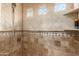 Large walk in shower with tiled walls and window at 11305 S 195Th Dr, Buckeye, AZ 85326