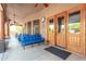 Covered patio with seating area and access to backyard at 11305 S 195Th Dr, Buckeye, AZ 85326