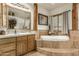 Spa-like bathroom with soaking tub and double vanity at 11305 S 195Th Dr, Buckeye, AZ 85326