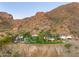 Aerial view of a home nestled on a mountainside, overlooking breathtaking scenery at 5500 N Dromedary Rd, Phoenix, AZ 85018