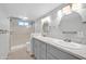 Modern bathroom with double vanity and a walk-in shower at 6834 E 4Th St # 8, Scottsdale, AZ 85251