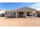 Home's backyard with covered patio and grill at 2771 N Mulberry Pl, Casa Grande, AZ 85122