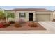 One-story home with a two-car garage and desert landscaping at 2771 N Mulberry Pl, Casa Grande, AZ 85122