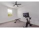 Bright bedroom with exercise bike and weight bench at 2771 N Mulberry Pl, Casa Grande, AZ 85122