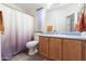 Bathroom with a toilet, vanity, and shower/tub combo at 701 S Dobson Rd # 413, Mesa, AZ 85202