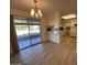 Light and airy dining area with sliding glass doors leading to patio at 9902 W Sandstone Dr, Sun City, AZ 85351