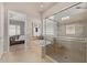 Elegant bathroom with a soaking tub and a walk-in shower at 27078 W Yukon Dr, Buckeye, AZ 85396