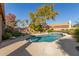 Sparkling blue pool with a waterfall feature and ample surrounding patio space at 491 W Courtney Ln, Tempe, AZ 85284