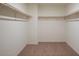 Large walk-in closet with double hanging rods at 3827 S 97Th Ave, Tolleson, AZ 85353