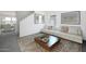 Spacious living room featuring a comfortable sofa and large windows at 3827 S 97Th Ave, Tolleson, AZ 85353
