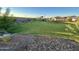 Community greenbelt with grassy area and rock landscaping at 3827 S 97Th Ave, Tolleson, AZ 85353