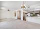 Living room with kitchen access and open floor plan at 15131 W Black Gold Ln, Sun City West, AZ 85375