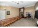 Living room with leather sofas, a home gym and high ceilings at 11519 W Clover Way, Avondale, AZ 85392