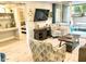 Open living room with access to bedroom and patio at 7625 E Camelback Rd # B108, Scottsdale, AZ 85251