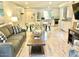 Open living area with gray sofa and view of kitchen at 7625 E Camelback Rd # B108, Scottsdale, AZ 85251