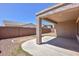 Covered patio and a fenced backyard with gravel at , Goodyear, AZ 85338