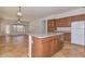 Spacious kitchen with island, granite countertops, and wooden cabinets at , Goodyear, AZ 85338