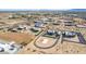 Aerial view of a community with several houses at 20324 W Melanie Dr, Wittmann, AZ 85361