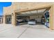 Three-car garage, Tesla charger, and ample storage at 20324 W Melanie Dr, Wittmann, AZ 85361