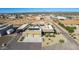 Aerial view of a house with solar panels and a large yard in a desert environment at 20324 W Melanie Dr, Wittmann, AZ 85361