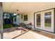 Covered patio with bench and double doors leading to the backyard at 8151 W Clarendon Ave, Phoenix, AZ 85033