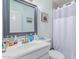 Clean bathroom with vanity, mirror, and shower/tub combo at 8151 W Clarendon Ave, Phoenix, AZ 85033