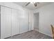 Bedroom with a double door closet and ceiling fan at 8151 W Clarendon Ave, Phoenix, AZ 85033