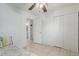 Bedroom with twin bed, access to bathroom, and built-in closet at 8151 W Clarendon Ave, Phoenix, AZ 85033
