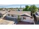 Aerial view of single story home with driveway and landscaping at 8151 W Clarendon Ave, Phoenix, AZ 85033