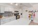 Bright kitchen features white cabinets, tile backsplash, and an island at 8151 W Clarendon Ave, Phoenix, AZ 85033