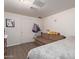 Spacious bedroom with a couch, large bed, and plenty of storage at 8151 W Clarendon Ave, Phoenix, AZ 85033