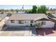 Aerial view of single story home with driveway and landscaping at 8151 W Clarendon Ave, Phoenix, AZ 85033