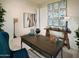 Bright home office with a large desk, wall art, and comfortable chair at 20640 N Confetti Ct, Maricopa, AZ 85138