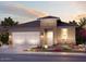 Single-story home with a three-car garage and desert landscaping at 20640 N Confetti Ct, Maricopa, AZ 85138
