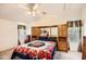 Main bedroom with mirrored wardrobe and ceiling fan at 6960 W Peoria Ave # 197, Peoria, AZ 85345