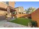 Private backyard with artificial turf and covered patio at 17365 N Cave Creek Rd # 109, Phoenix, AZ 85032