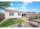 Spacious backyard with hot tub, patio, and lawn games at 17917 W Amberwood Dr, Goodyear, AZ 85338