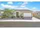 Single-story home with landscaped yard and two-car garage at 17917 W Amberwood Dr, Goodyear, AZ 85338
