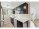 Modern kitchen with stainless steel appliances and white countertops at 4812 N 73Rd St, Scottsdale, AZ 85251