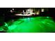 Night view of a sparkling pool with a fountain and inviting ambiance at 23852 N 167Th Ln, Surprise, AZ 85387