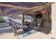 Outdoor patio with seating area, covered awning and TV at 23852 N 167Th Ln, Surprise, AZ 85387