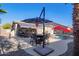 Covered patio with seating area, pool, and landscape at 23852 N 167Th Ln, Surprise, AZ 85387
