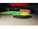 Inviting pool with colorful lights at night, umbrella, and waterfall feature at 23852 N 167Th Ln, Surprise, AZ 85387