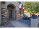 Inviting entryway with stone pillars, comfortable seating, and a patterned rug at 23852 N 167Th Ln, Surprise, AZ 85387