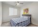 Bright bedroom with a comfy bed, window blinds, and large artwork at 23852 N 167Th Ln, Surprise, AZ 85387